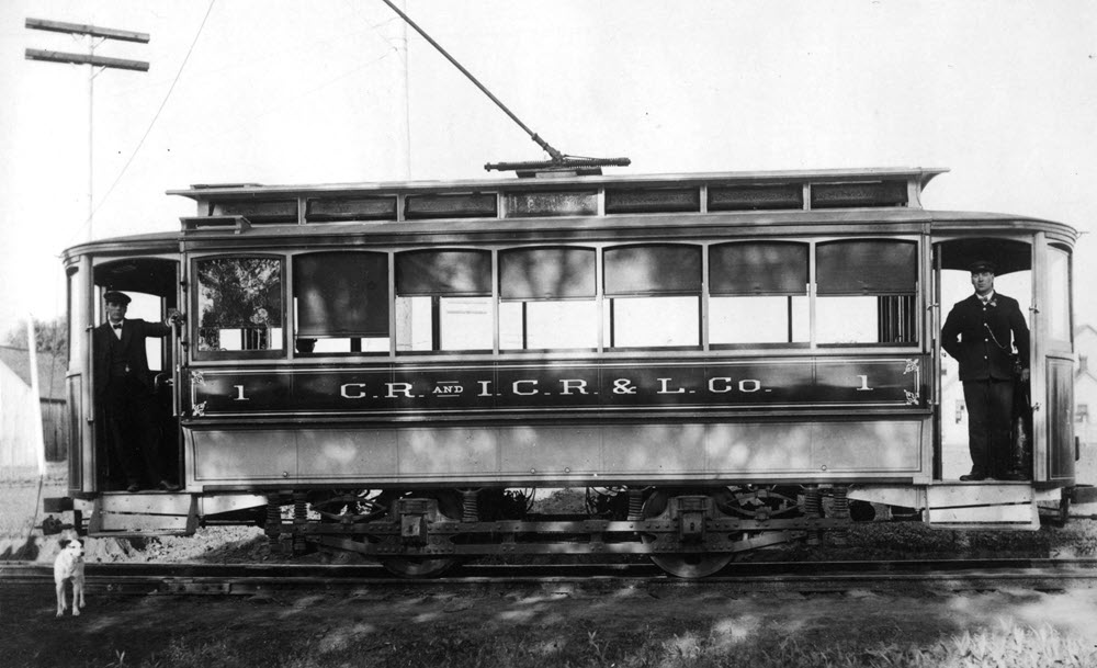 old photograph of an early passenger rail car
