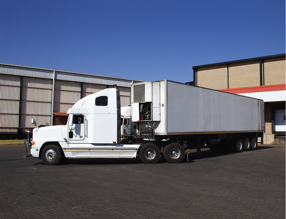 semi truck at a warehouse