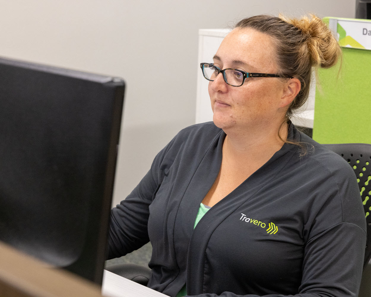 Travero employee on a computer