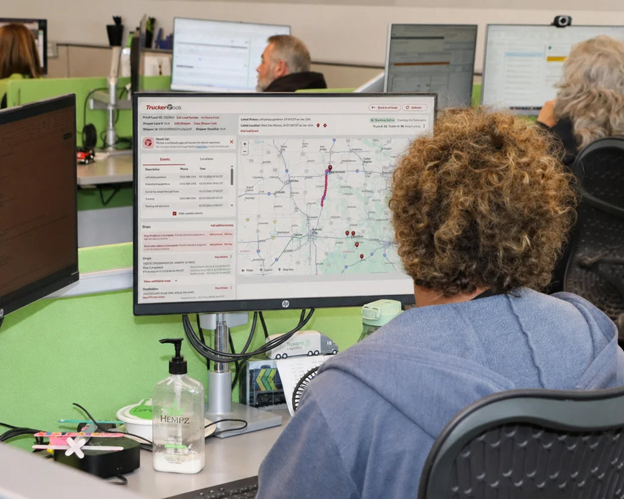 Travero's logistics team on computers